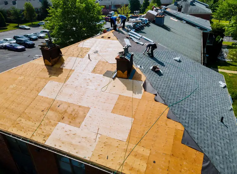 A roof being inspected for damage and wear